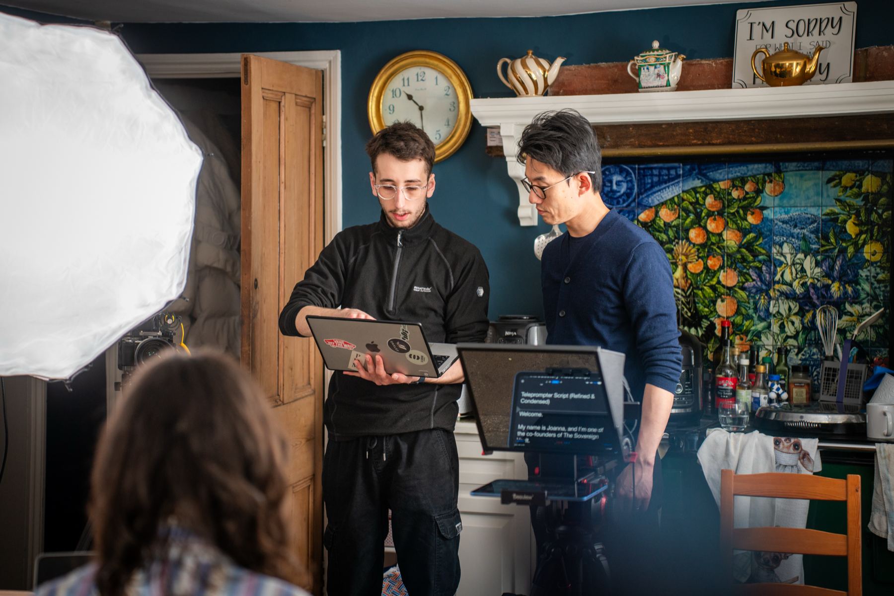 The rig in use during filming, with the script screen lying flat beneath the angled glass.
