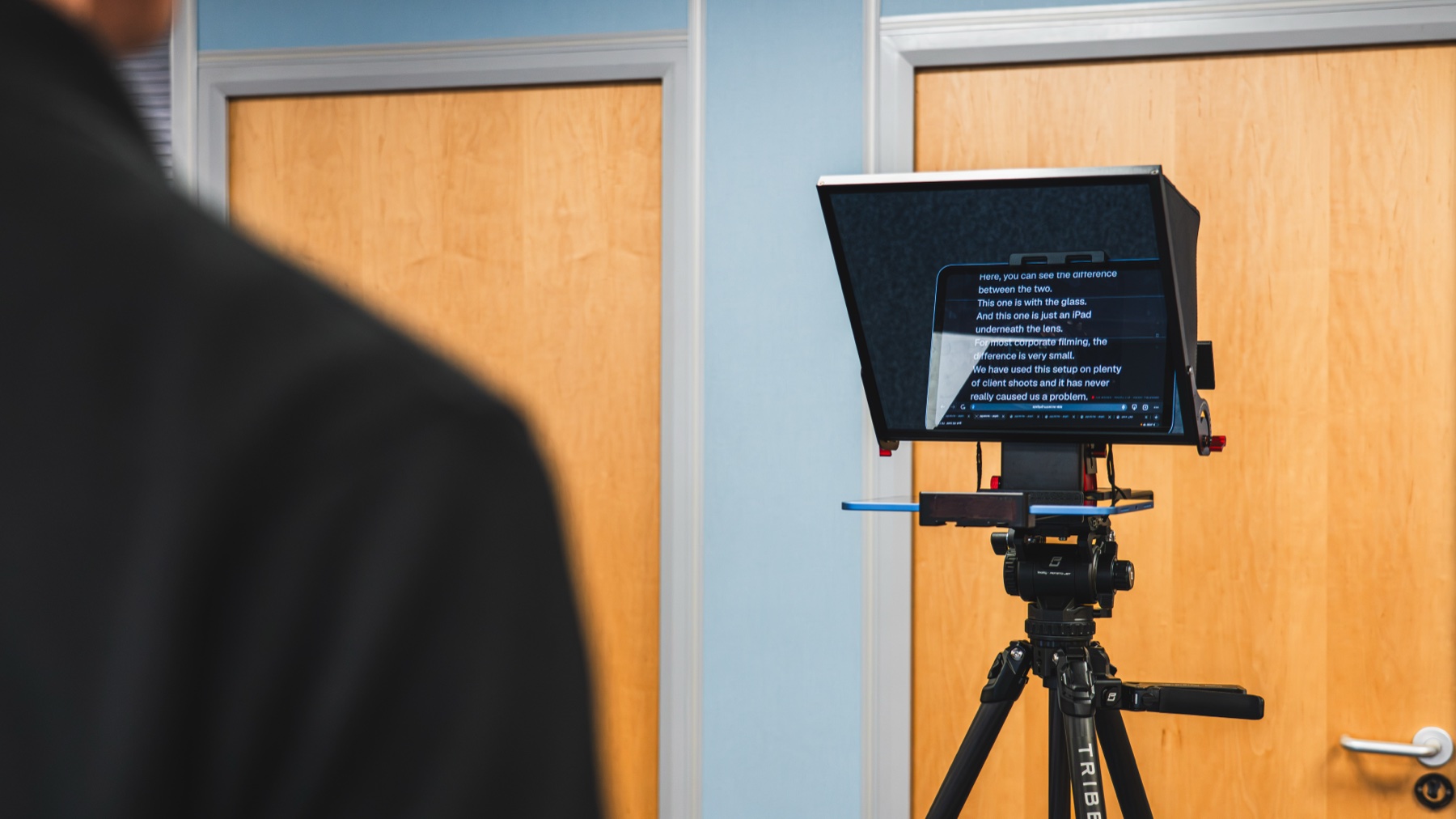 A beam-splitter teleprompter rig on one of our shoots, the script showing on the angled glass in front of the camera lens.