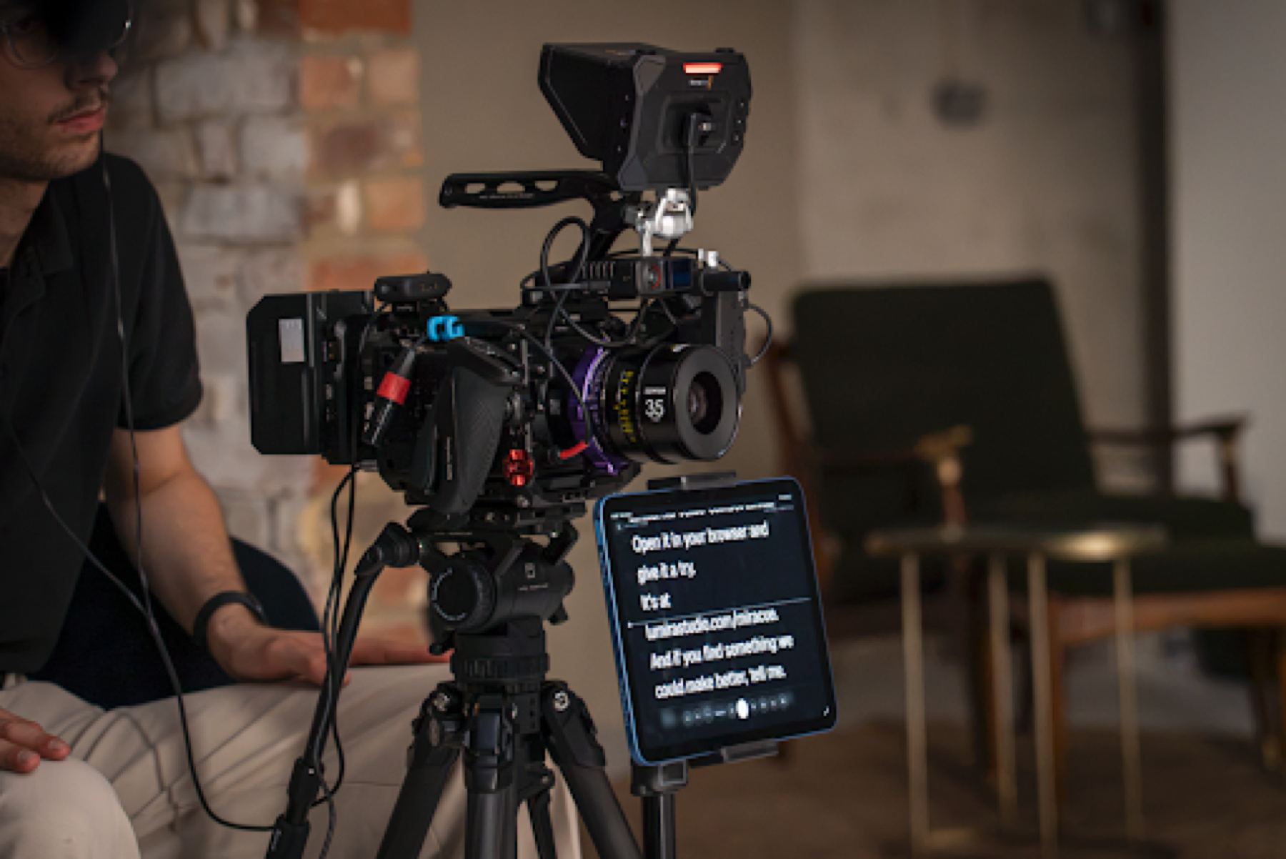 An iPad running a teleprompter placed directly beneath the camera lens, with no beam-splitter glass.