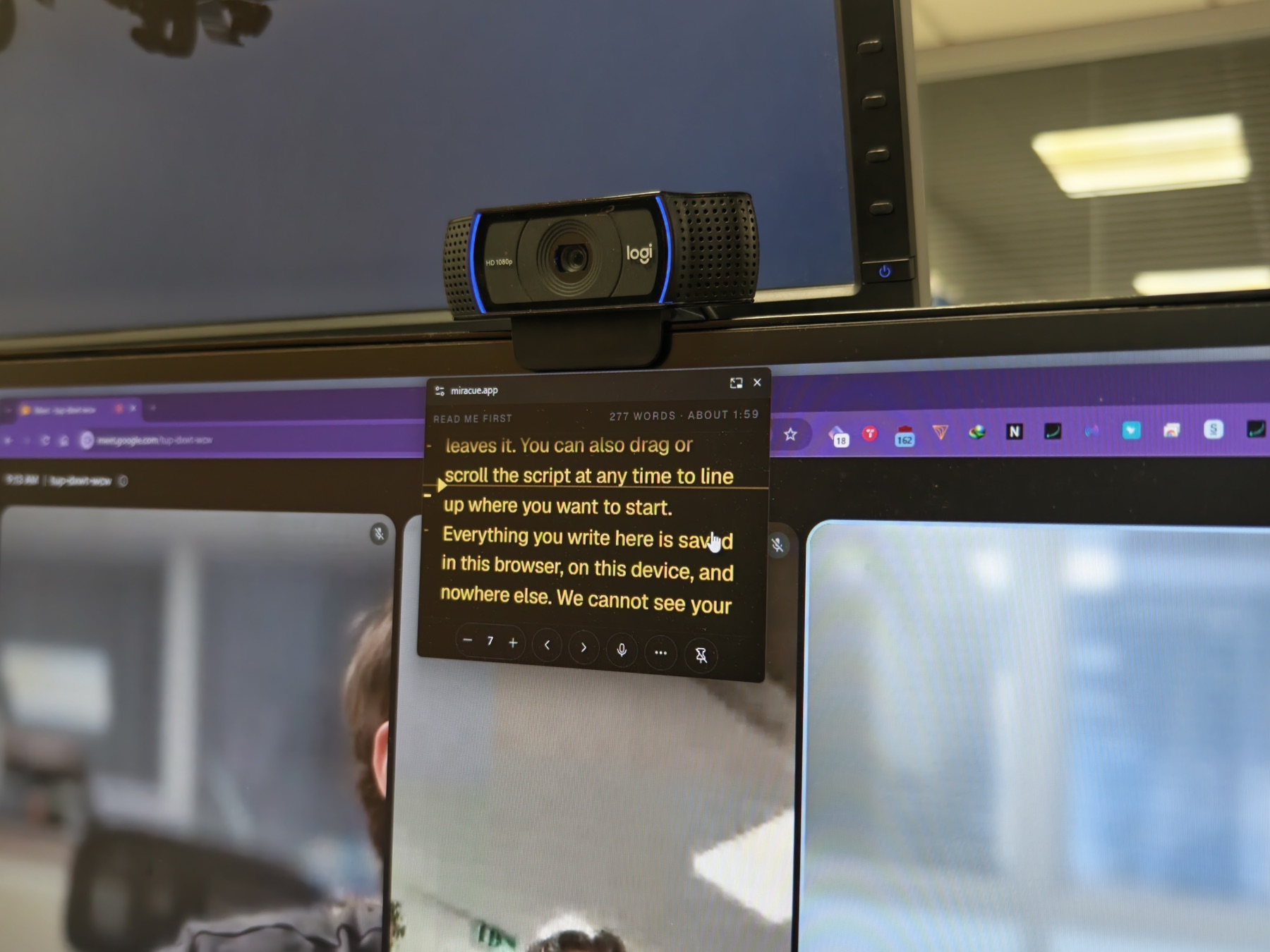 A webcam clipped to the top of a monitor, with the Miracue script pinned in a small floating window directly beneath it, over a live video call.